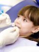 Почему у детей чернеют молочные зубы?